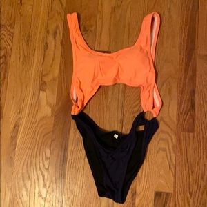 NWOT orange and blue open stomach/back swim suit